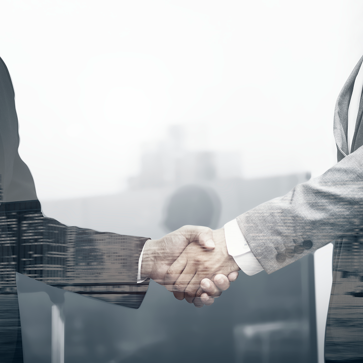 Business partners handshake in an international corporate setting